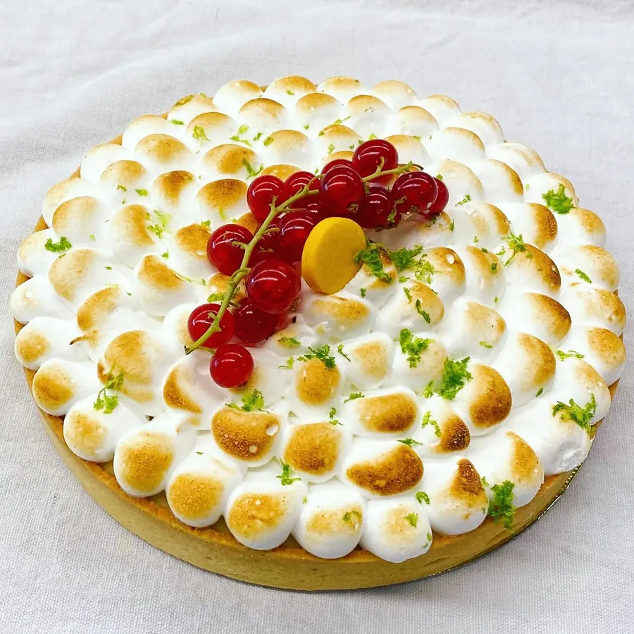 Tarte citron with torched meringue and raspberries